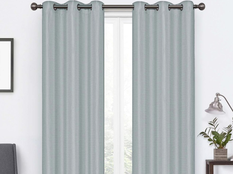 light blue textured curtain panels over window