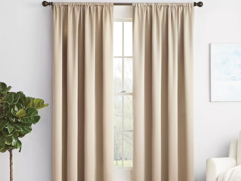 taupe blackout curtains over window