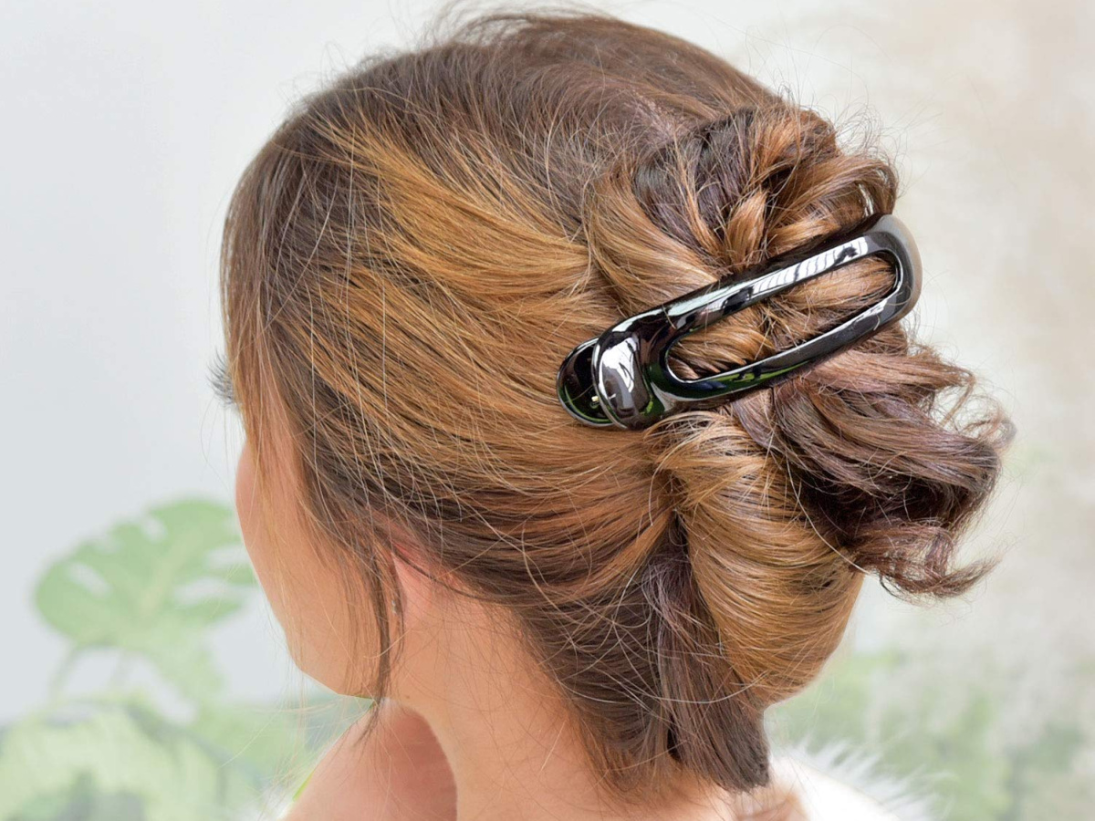 woman with flat clip in hair bun