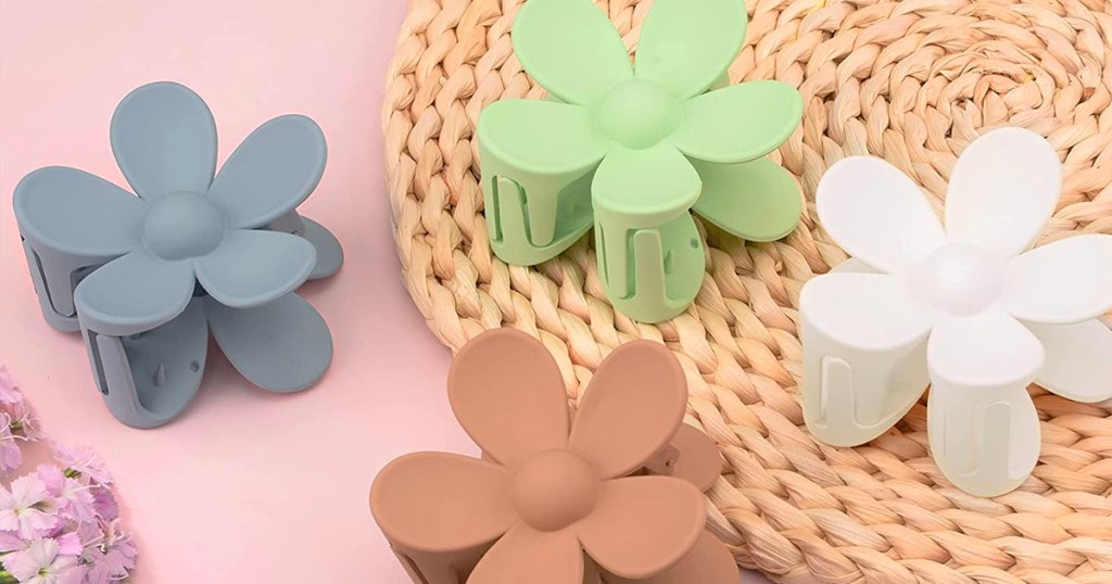 blue, green, white and brown flower hair clips on counter 