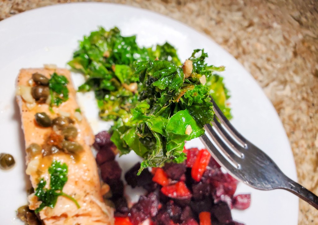 lettuce on fork above salmon and beets