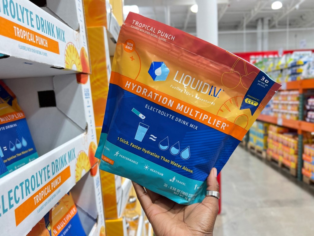 hand holding Liquid I.V. Hydration Multiplier tropical punch 30 Pack at the store