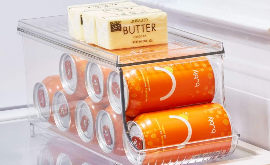 cans of soda in plastic organizer in fridge
