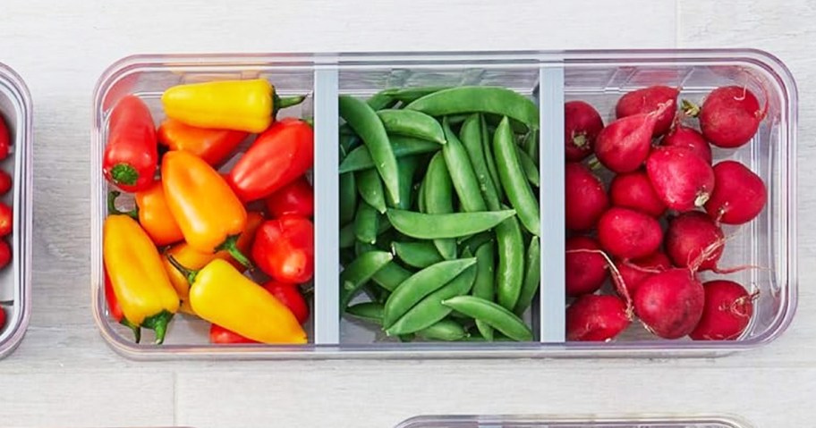 peppers, green beans, and radishes in divided food storage container