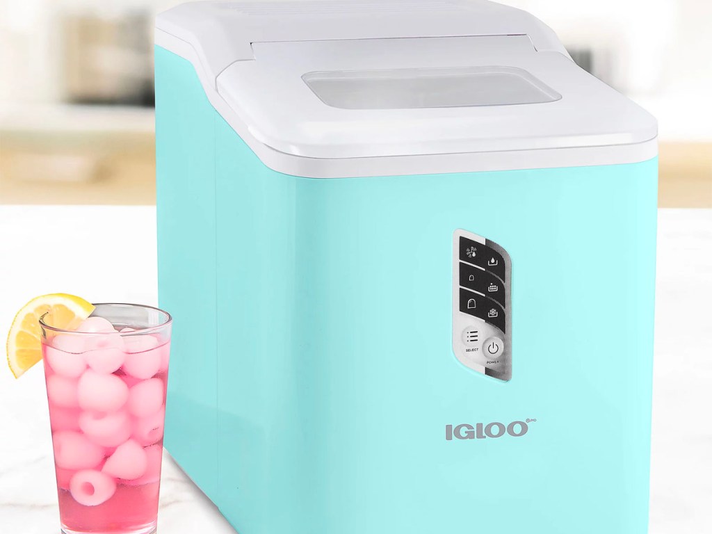 teal portable ice maker next to pink drink