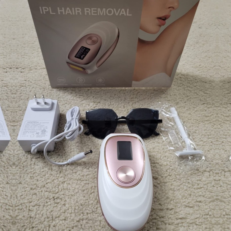 ipl hair removing tool with accessories near box