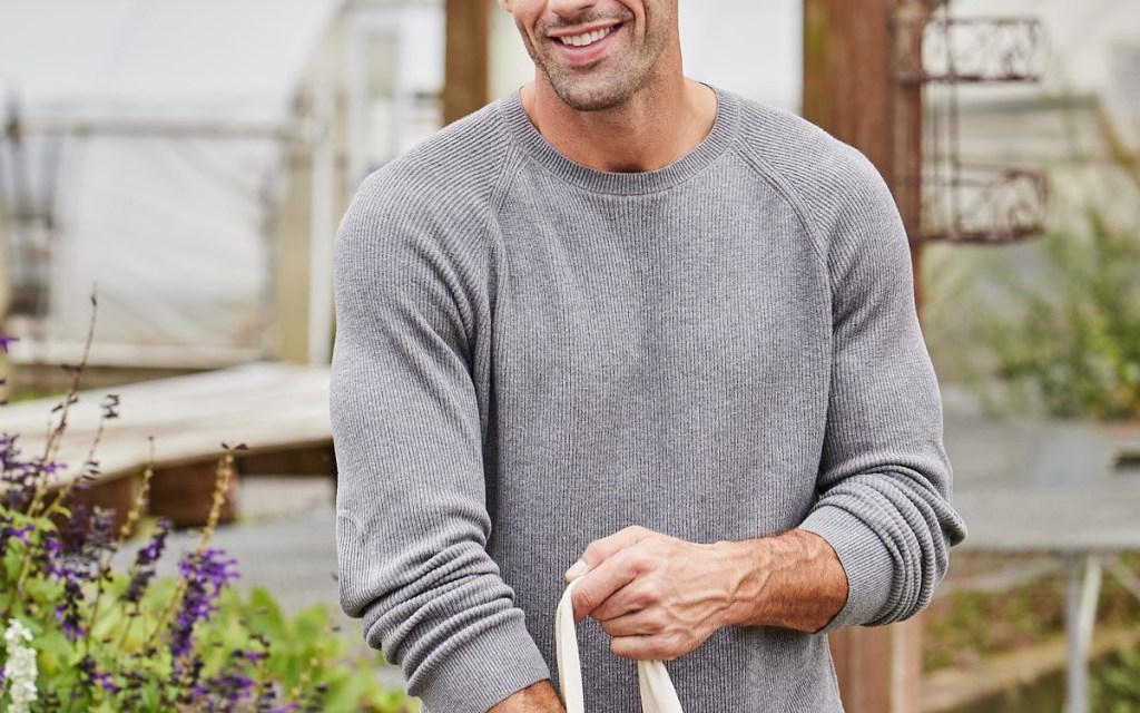 guy wearing grey long sleeve shirt in garden