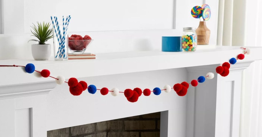 red, white and blue Disney Mickey mouse garland across a mantle