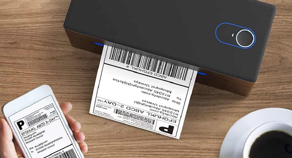 label maker with label printing and smart phone in hand