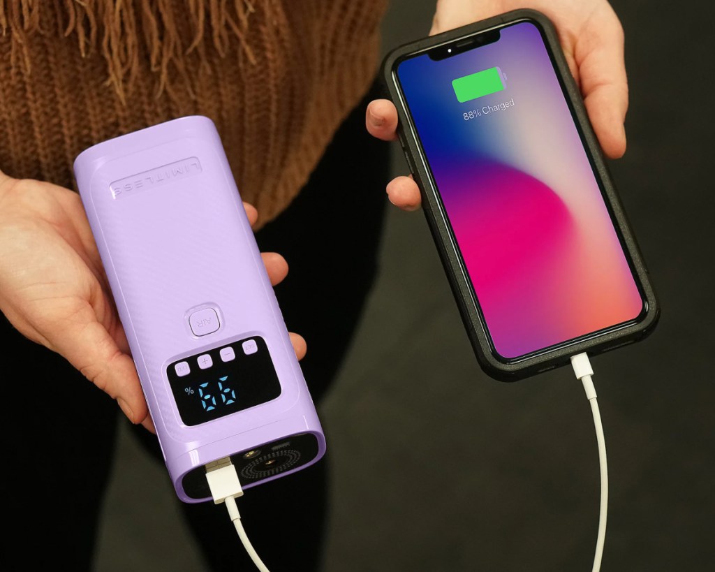 purple handheld compressor & power bank charging phone