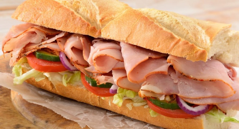 loaded new subway sandwich filled with ham and tomatoes and onions