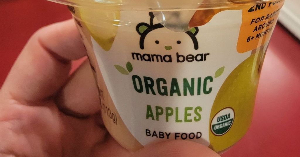 hand holding mama bear organic apples baby food
