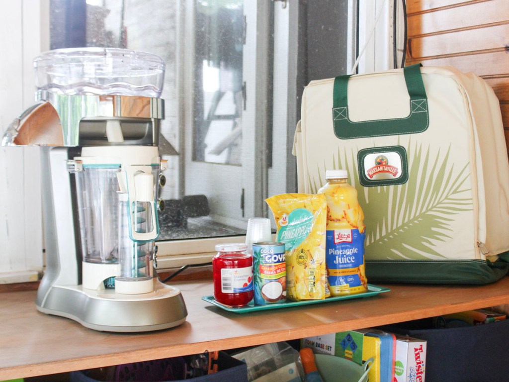 margaritaville maker with bag and drink ingredients on counter