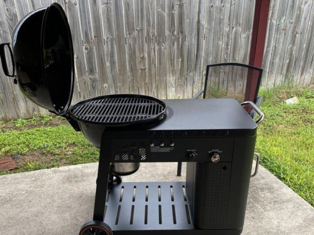 grill assist charcoal grill on patio