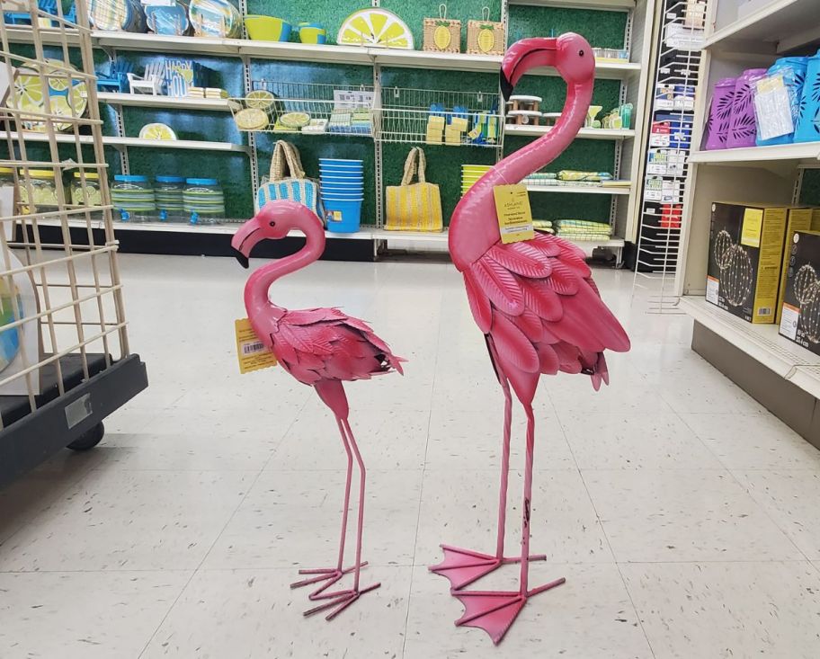 2 metal flamingos