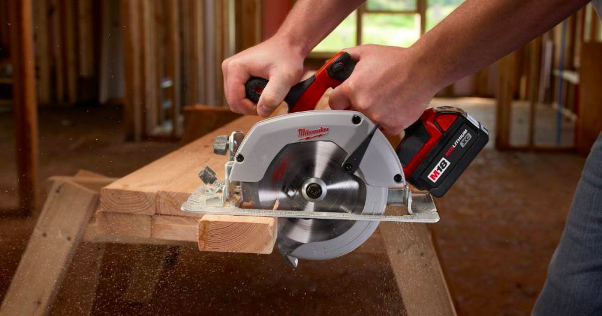 a man using a circular saw from the milwaukee M18 18V Lithium-Ion Cordless Combo Tool Kit