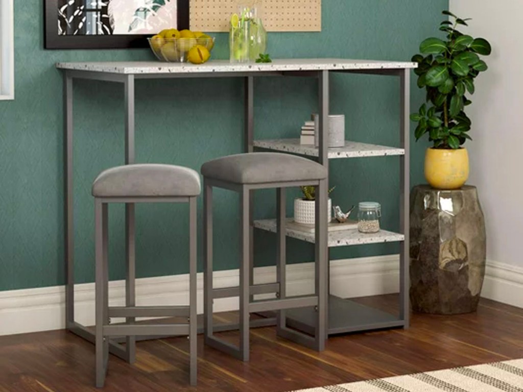 gray table with two stools 