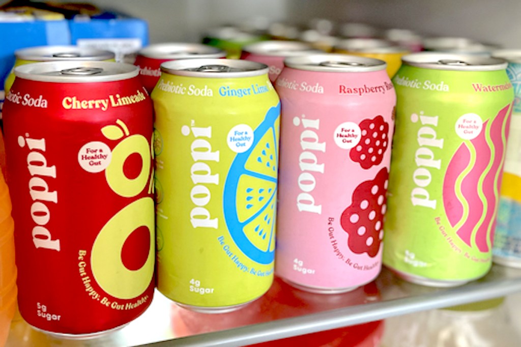 various cans of poppi cans on shelf