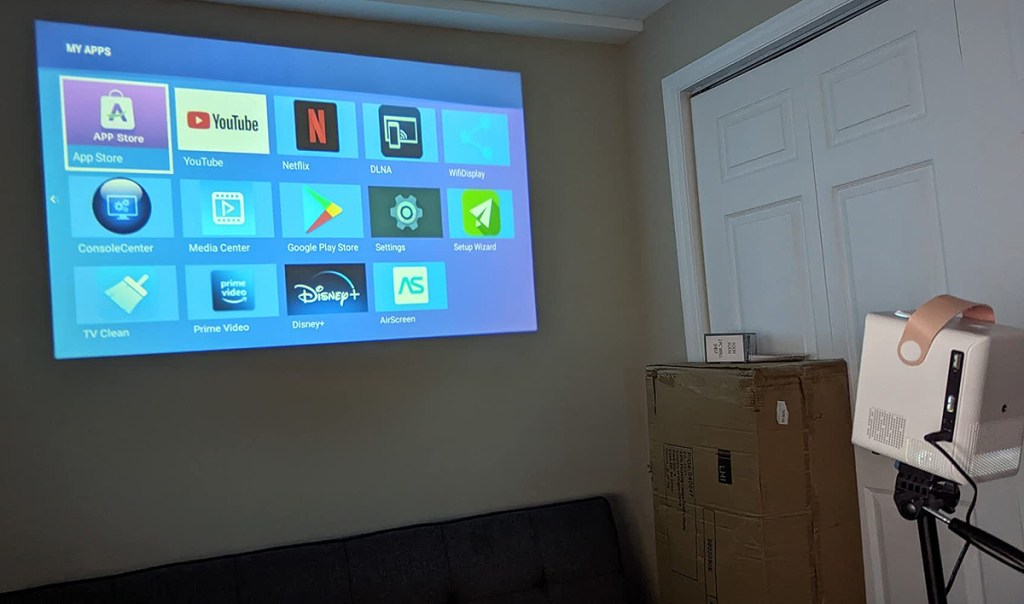 projector showing tv stations on a wall 