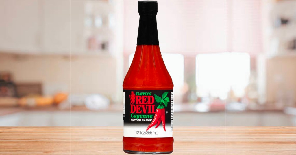 red devil hot sauce bottle on counter