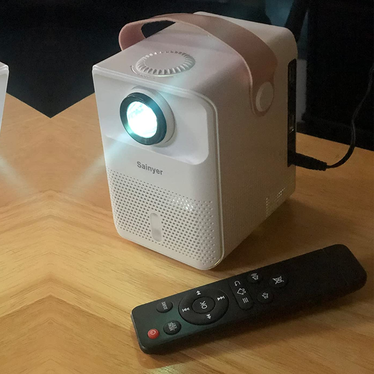 Mini Portable Projector w/ Remote Just $67.93 Shipped on Amazon (Comes w/ Pre-Installed Apps, Like Netflix!)