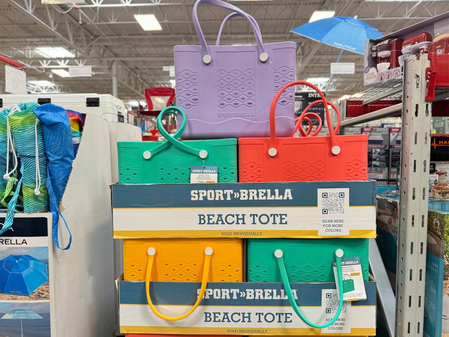 red, yellow, purple and green sport brella beach totes on display in sams club store