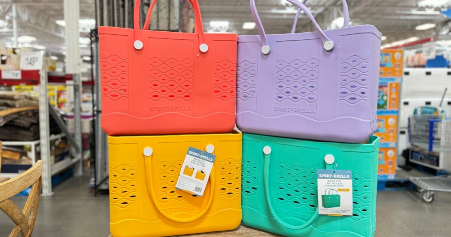 red, yellow, purple and green sport brella beach totes stacked on each other in sams club store