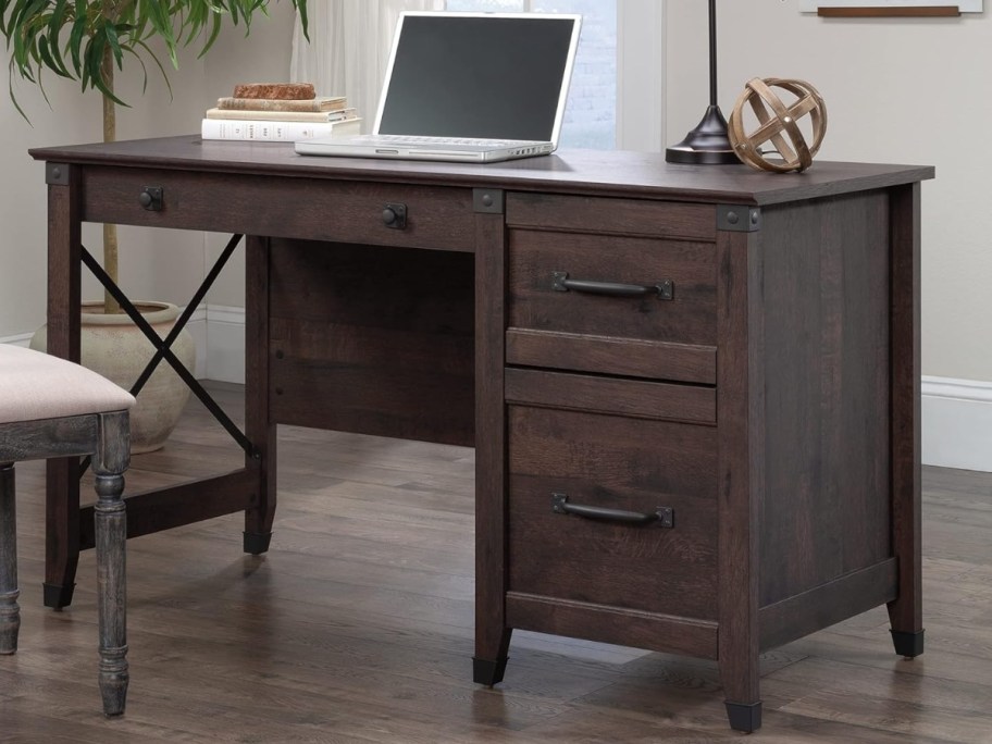 dark cedar wood desk in a home office