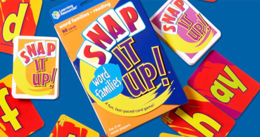 snap it up card game box with cards laying around it