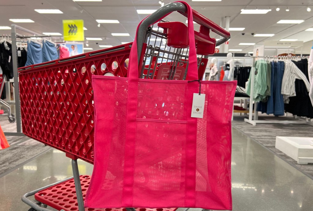 pink tote hanging on target shopping cart