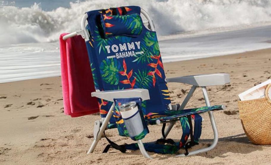 a tropical print tommy bahama beach chair on a beach