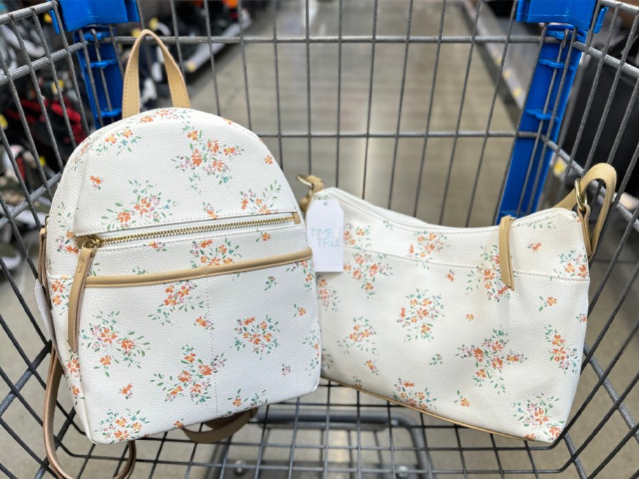 white floral backpack and shoulder bag in Walmart shopping cart
