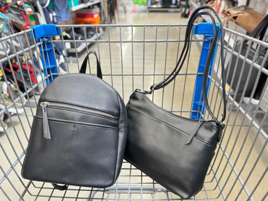 black backpack and shoulder bag in Walmart shopping cart