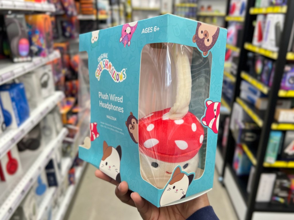 woman holding Squishmallows Plush Wired Headphones - Malcolm