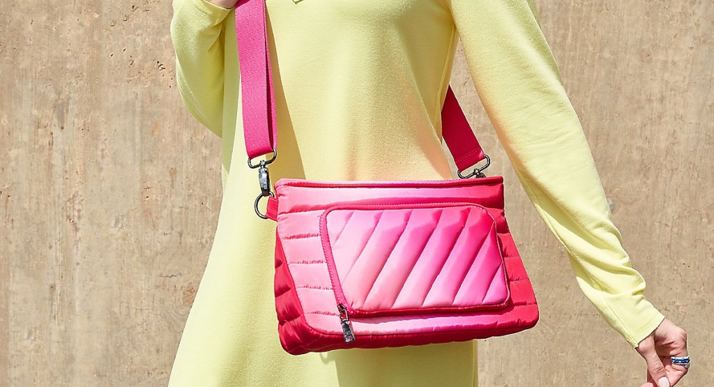 woman wearing pink bag with pouch