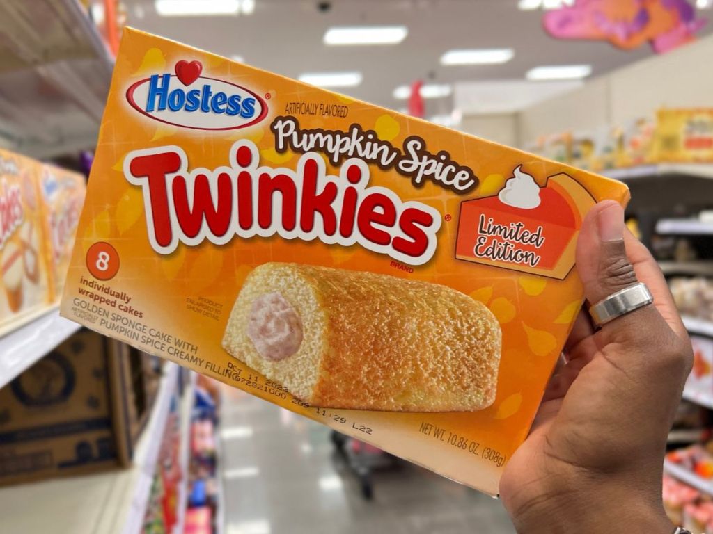 Hostess Iced Pumpkin Spice Twinkies 8 Count in woman's hand at Target