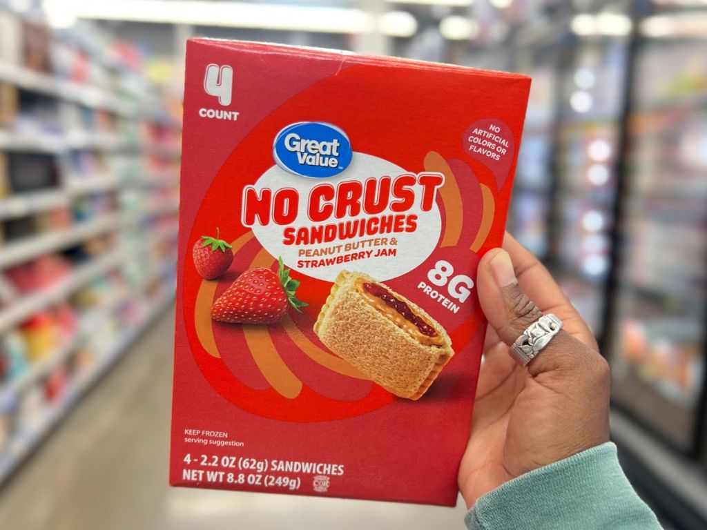 Great Value No Crust Peanut Butter & Strawberry Jelly Sandwiches box woman's hand at Walmart