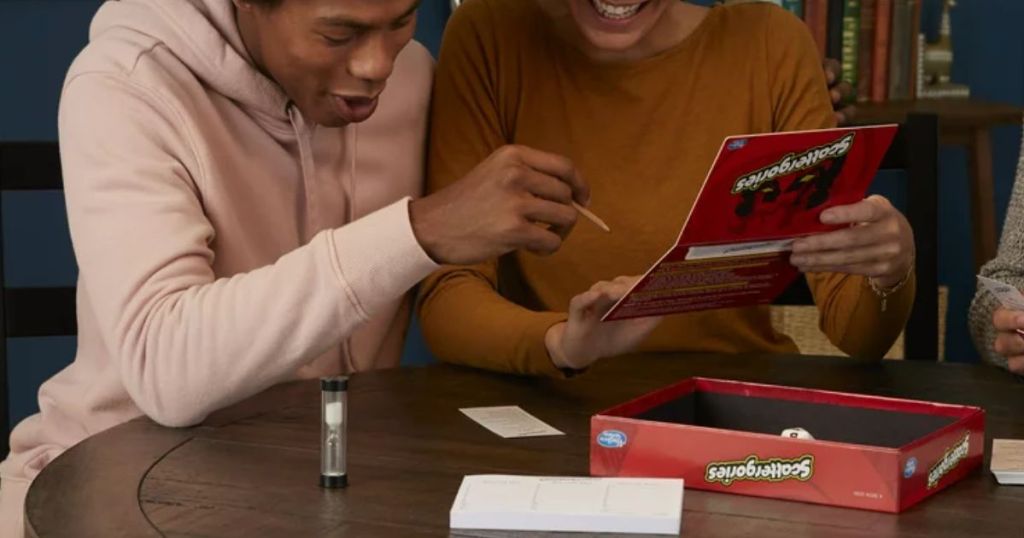 Classic Scattergories Board Game shown being played by a woman and man