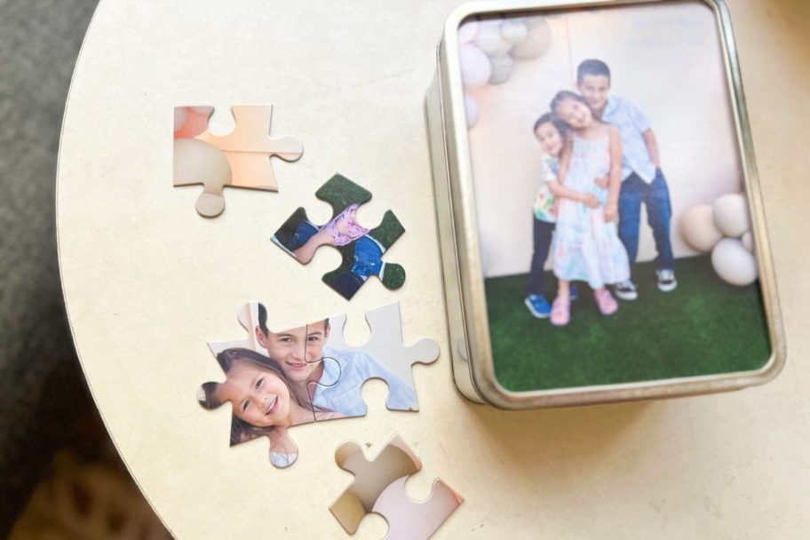 Walgreens Photo Puzzle with pieces shown on table beside of the Keepsake Tin