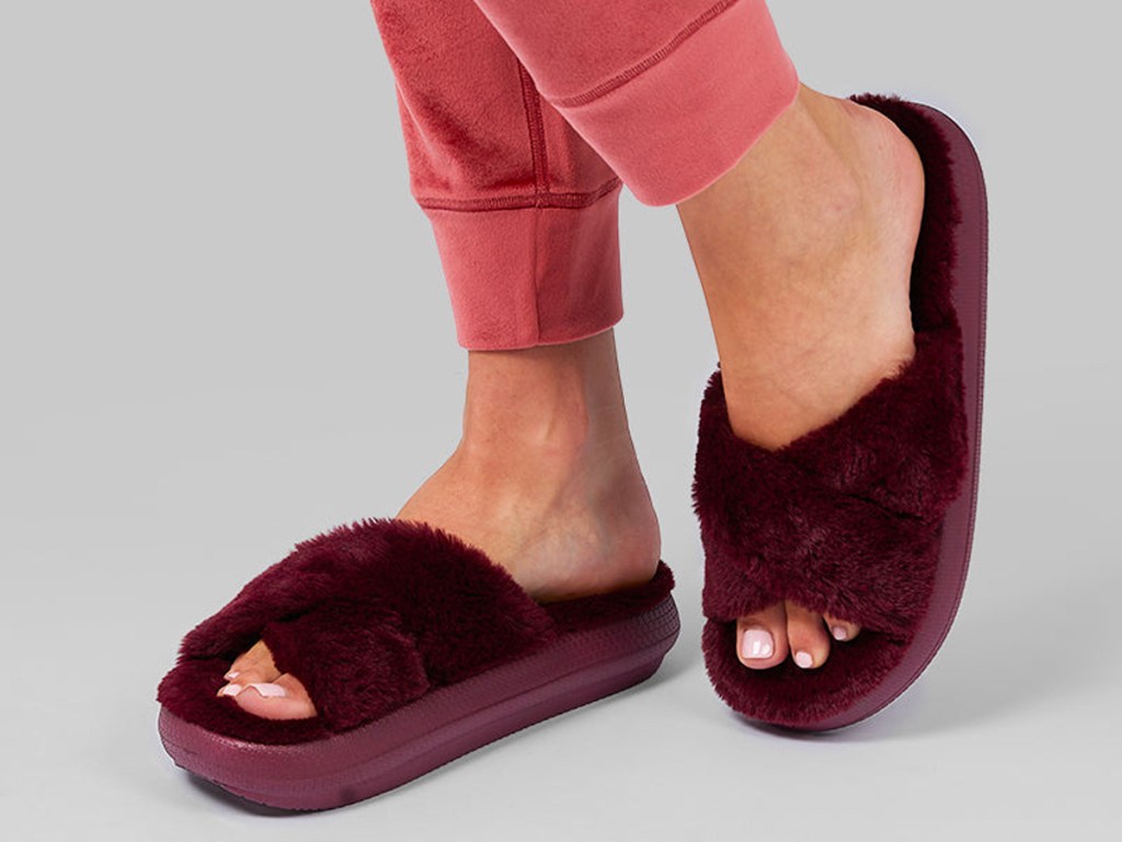 woman wearing maroon slippers