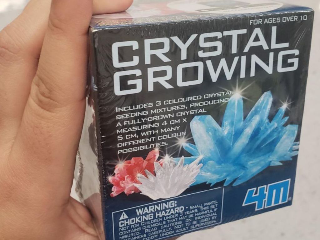Hand holding a 4M Crystal Growing Kit
