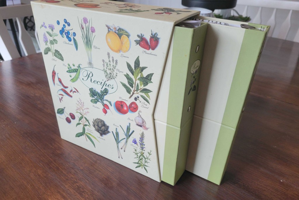 A personalized recipe box sitting on a kitchen counter