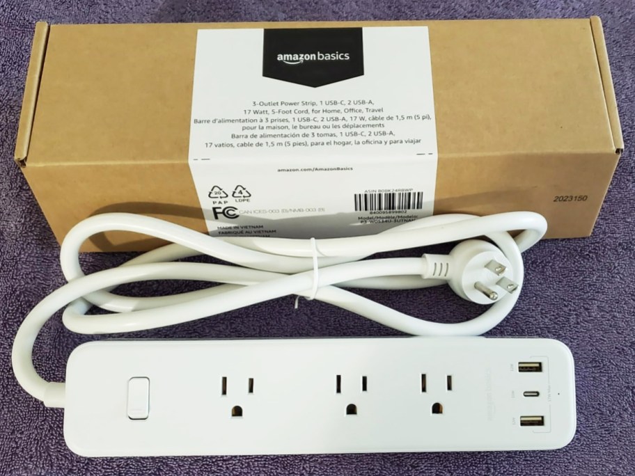 white power strip and cord outside of it's shipping box