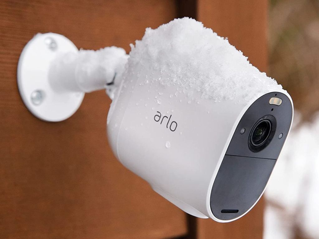 Arlo outdoor security camera with spotlight with snow on it
