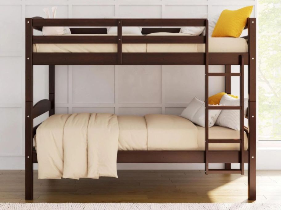 A Better Homes & Gardens Twin over Twin Bunk Bed in the brown color option