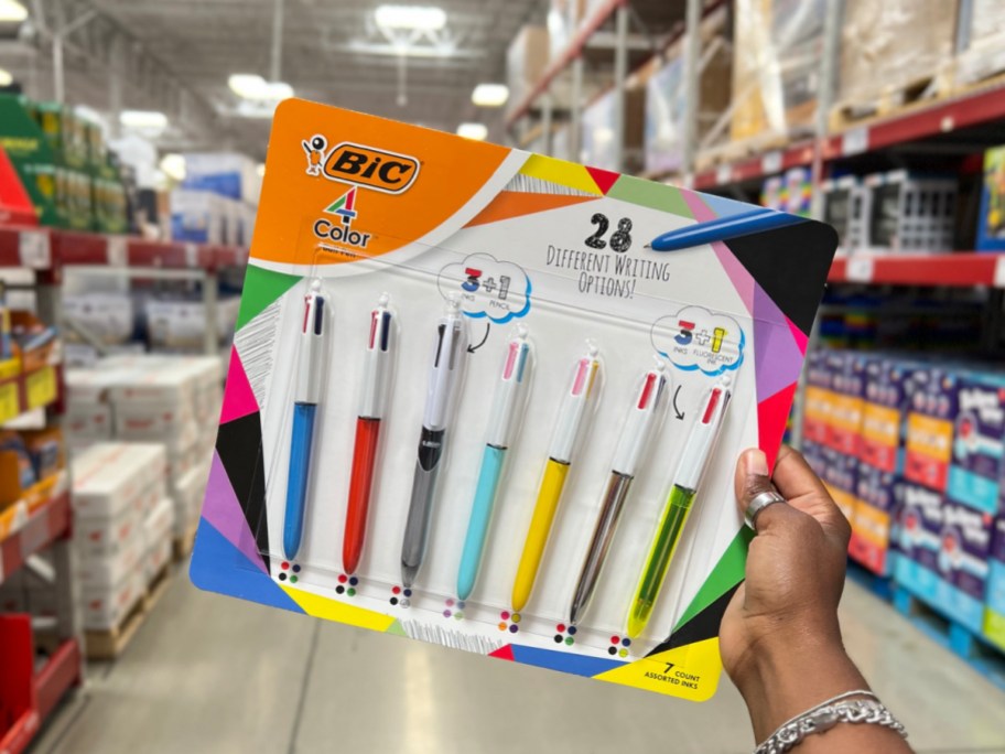 BIC 4-color retractable ballpoint pen 7 pack in female hand
