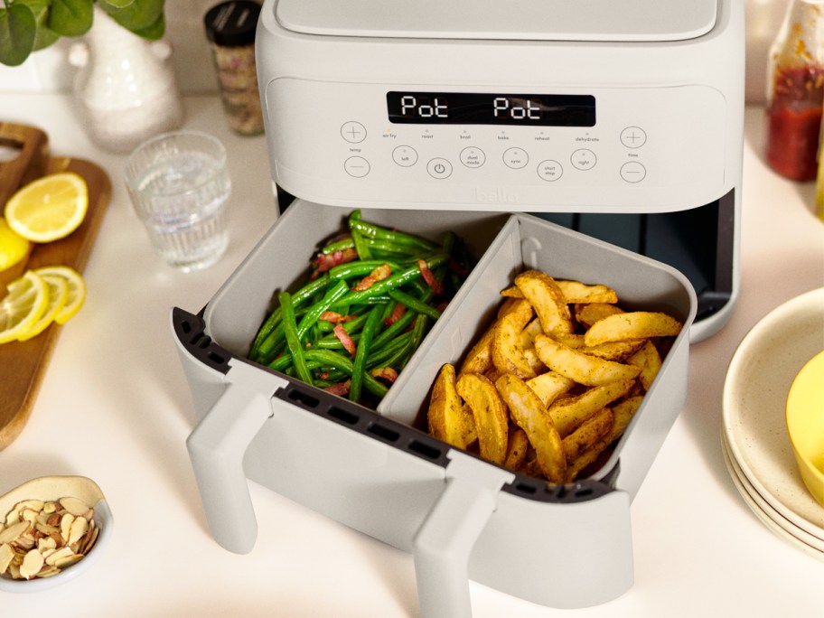 green beans and potatoes in basket of air fryer