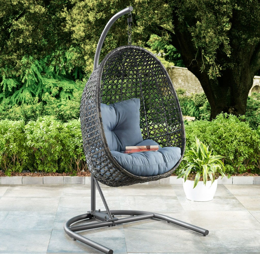grey hanging patio egg chair on a stand