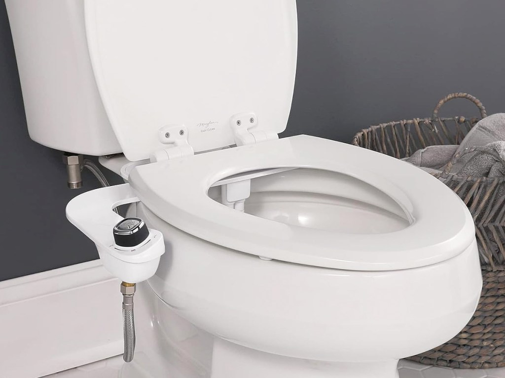opened toilet seat with bidet attachment