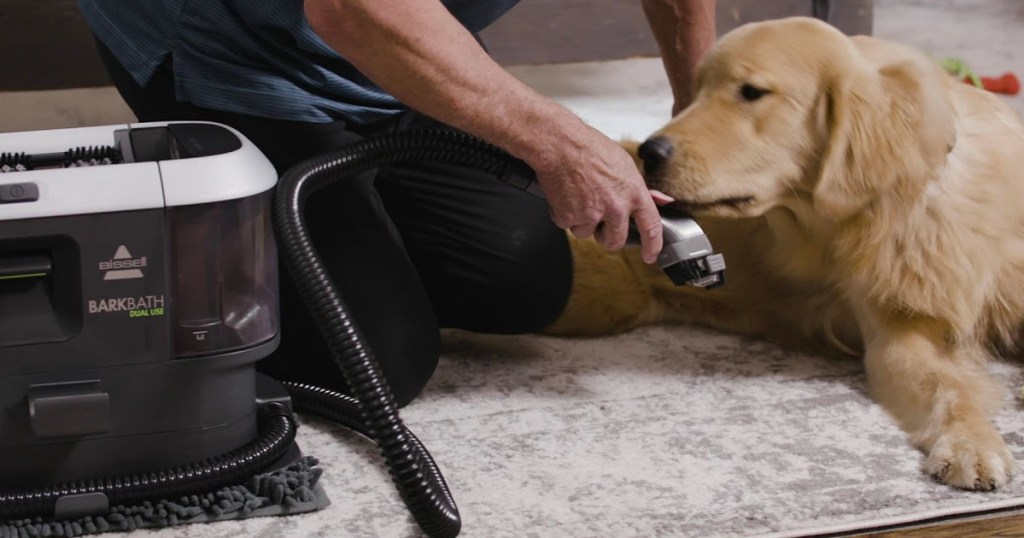 Bissell BarkBath being used on a dog